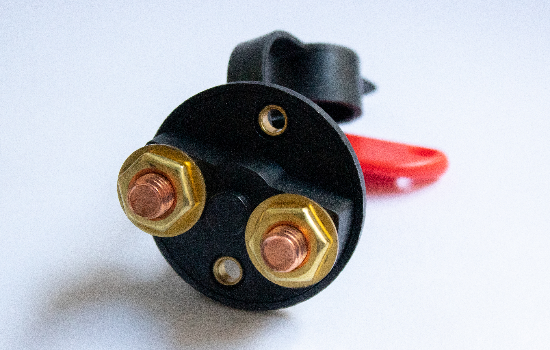 Battery disconnect switch used as a battery isolator in marine, transportation and automotive applications. The switch's handle is detachable, allowing it to be easily removed to deter tampering. It is water and dust rated up to IP54 and provides ignition